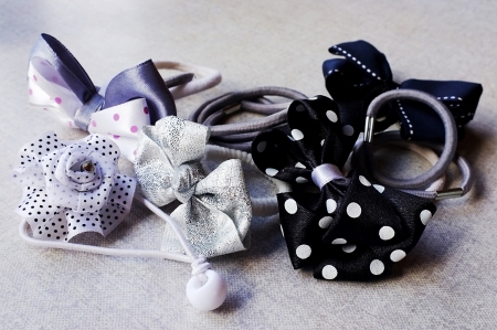 A few elastic hair bands - simple and in the shape of bows and flowersの写真素材