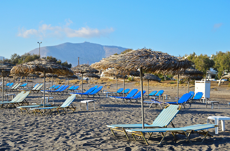 View over black sand beach Monolithos in Santorini, Greeceの写真素材