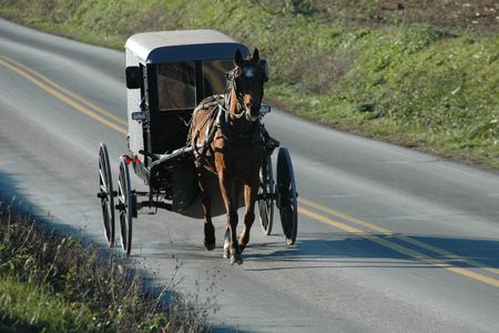 An Amish buggy on the road in Pennsylvaniaの写真素材