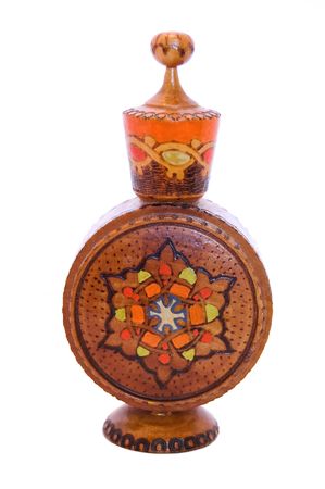 Wooden perfume bottle with ornamentの写真素材