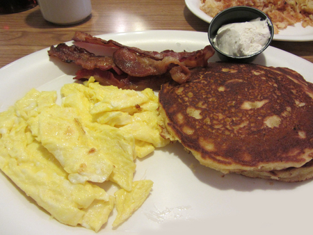 Pancakes Scrambled Eggs and Bacon Breakfastの写真素材