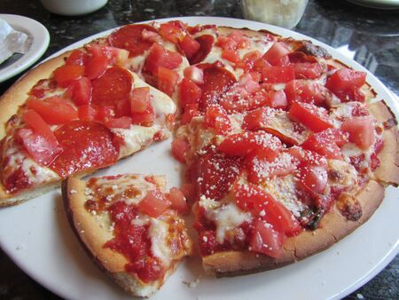 Tomato and Pepperoni Hand Tossed Pizzaの写真素材