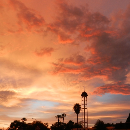 Church bell tower with glorious sunriseの写真素材