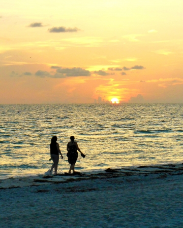 Walking on Beach at Sunsetの写真素材