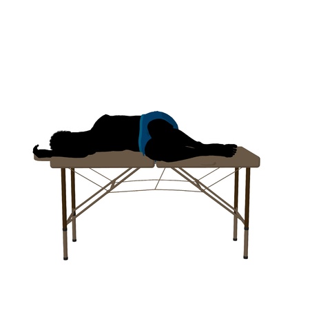 African american man on top of a massage table on a white backgroundの写真素材