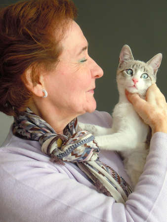 portrait of senior woman and her cat