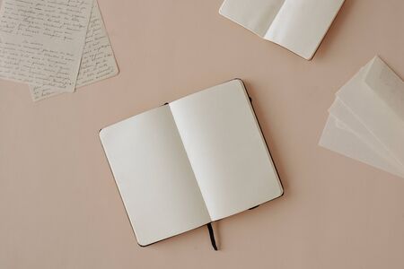 Open Blank Notebook and handwritten lettersの写真素材