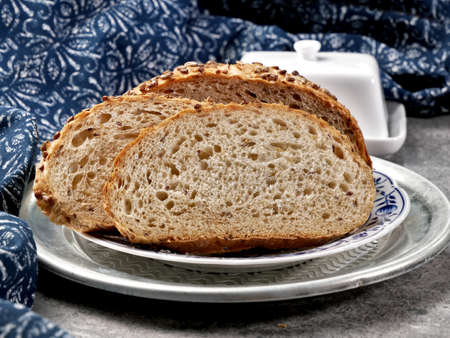 Traditional sourdough wheat bread with sunflower seeds. Homemade pastries from a traditional Polish...