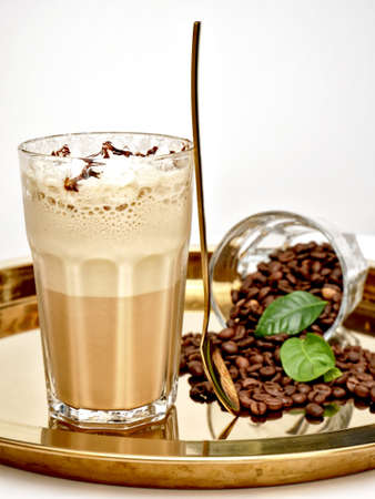 Caramel latte coffee in a tall glass.の写真素材