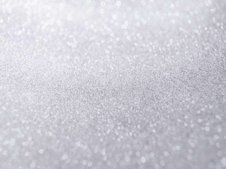 Silver blur glitter background with little bokeh light.の写真素材