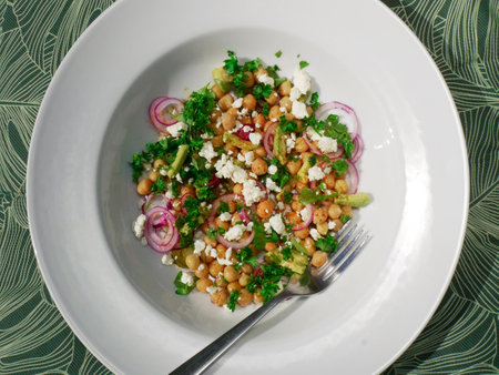 Chickpea and avocado salad with all the traditional elements of a great guacamole. Healthy, protein and fiber-filled dish perfect for lunch or dinner.の写真素材