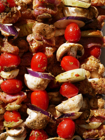 Skewers of vegetables and raw poultry meat prepared for the barbecue. Close up.の写真素材