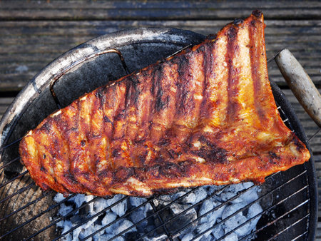 Pork ribs baked on the grill. An aromatic dish for pork connoisseurs.の写真素材