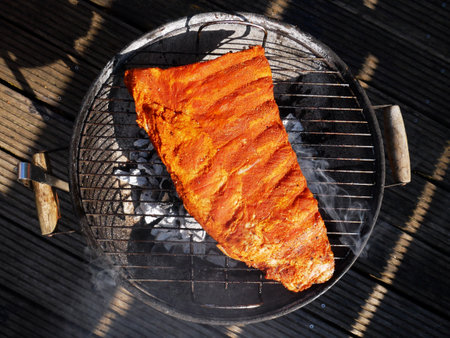 Pork ribs seasoned and prepared for grilling.の写真素材