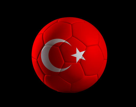 A red soccer ball with the flag of Turkey, featuring a white crescent and star, prominently displayed on it against a black background.の写真素材