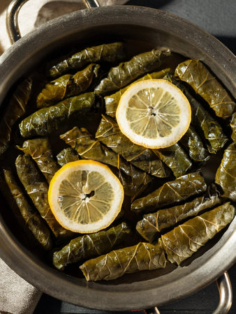 Dolmas, yaprak sarma - classic appetizer or meze. Grape leaves stuffed with rice and fresh herbs.の写真素材