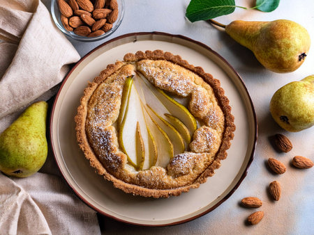 Crostata pear, almond and amaretti on a rustic wooden table. Perfect dessert with a golden-brown crust, ideal for fall baking inspiration.の写真素材