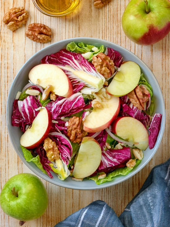 Radicchio salad with apples and walnuts. Full of nutritious ingredients and lots of vitamins.の写真素材