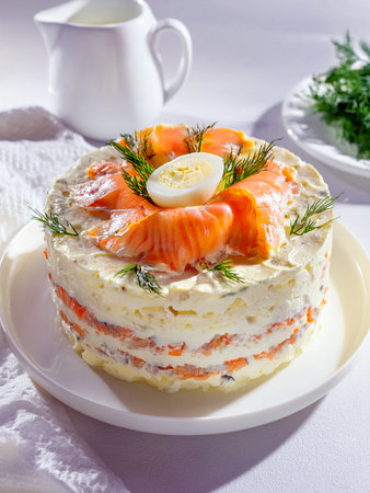 A savory parfait composed of layers of cream cheese, boiled quail eggs and salmon, garnished with aromatic dill. A tasty dish for Easter dinner or spring brunch.の写真素材