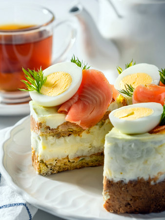 A savory parfait composed of layers of cream cheese, boiled quail eggs and salmon, garnished with aromatic dill. A tasty dish for Easter dinner or spring brunch.の写真素材