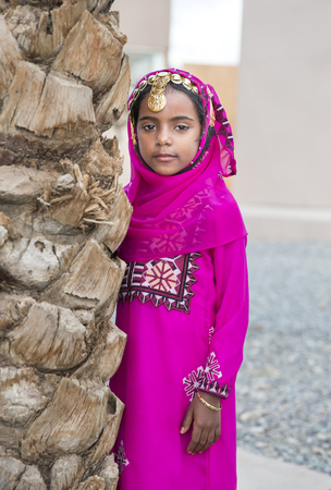 Muscat, Oman, February 4th, 2017: young omani girl in traditional outfitのeditorial素材