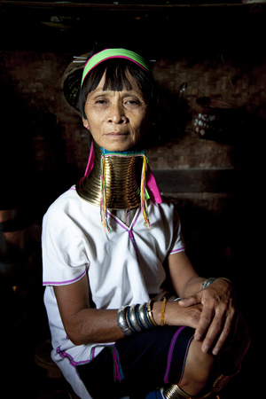 Lake Inle, Myanmar, November 17th 2014: Paduang Tribal woman in her kitchenのeditorial素材