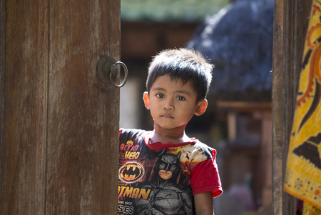 Bali, Indonesia, September 10th, 2016: balinese children outside their homeのeditorial素材