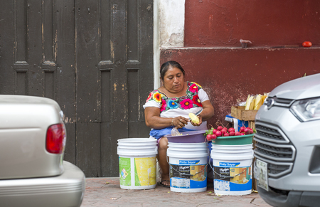 valladolid, Mexico, 13th March, 2017: woman selling vegetables outdoorsのeditorial素材