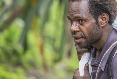 Baliem Valley, West Papua, Indonesia, February 12th, 2016: Local man in the countrysideのeditorial素材