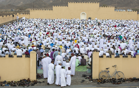 Nizwa, Oman - June 26th 2017: omani men dressed for Eid al Fitr day, that is celebrated at the end of Holy month of Ramadan, arriving at a morning prayersのeditorial素材