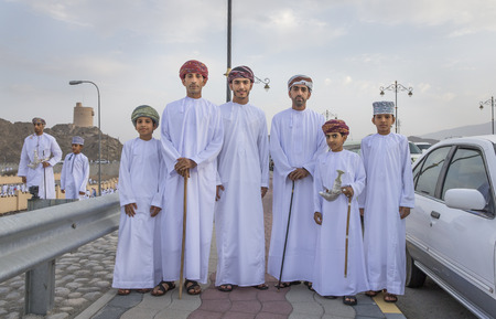 Nizwa, Oman - June 26th 2017: family in traditional clothing on a way to morning prayers at Eid al Fitr, celebration at the end of Holy Month of Ramadanのeditorial素材