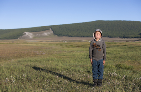 huvsgul, Mongolia, 4th September, 2017: mongolian kid in a landscape of northern Mongoliaのeditorial素材