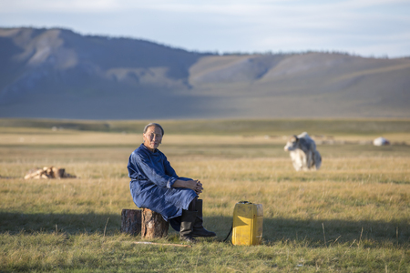 huvsgul, Mongolia, September 6th, 2017: mongolian woman resting outside her gerのeditorial素材