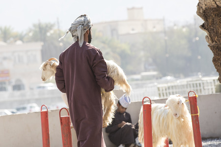 Nizwa, Oman, 10th Nobember 2017: omani people at a goat marketのeditorial素材