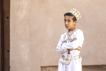 Nizwa, Oman, December 1st, 2017: omani boy in full omani traditional outfit