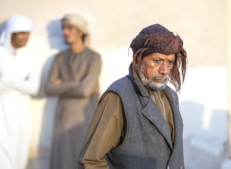 nizwa, Oman, December 1st, 2017: young men socialising at a marketのeditorial素材