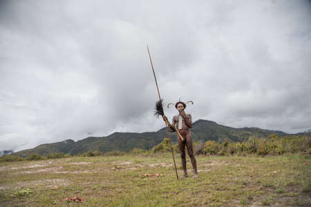 Baliem Valley, West Papua, Indonesia, February 2016: dani tribe man in traditional outfit