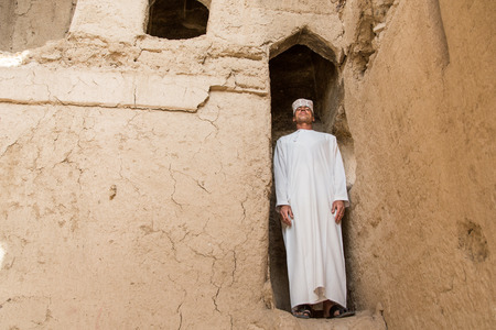 Ibri, Oman, April 2016: Omani man in traditional clothing in an old buildingのeditorial素材