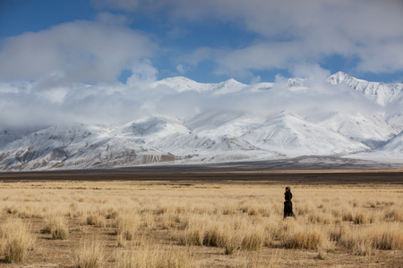ULGII, MONGOLIA - CIRCA OCTOBER 2015: older Mongolian lady outside in a landscape of Western Mongoliaのeditorial素材