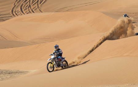 Dubai, United Arab Emirates, January 19th, 2018: two riders on dirt bikes in a desertのeditorial素材