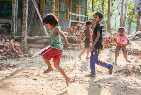 Chittagong, Bangladesh, 7th March, 2016: kid jumping in a village of rural Bangladeshのeditorial素材