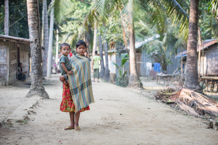 Chittagong, Bangladesh, 7th March, 2016:young woman with a kid in a remote villageのeditorial素材