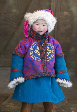 Hatgal, Mongolia, 4th March 2018: mongolian people dressed in traditional clothing on a frozen lake Khuvsgulのeditorial素材