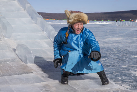 Hatgal, Mongolia, 4th March 2018: mongolian man dressed in traditional clothing on a frozen lake...