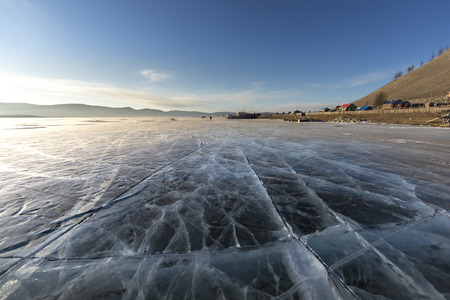 sunrise over frozen lake Khuvsgul in northern Mongoliaの写真素材