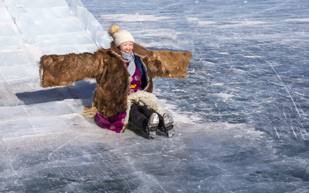 Hatgal, Mongolia, 4th March 2018: mongolian people dressed in traditional clothing on a frozen lake Khuvsgulのeditorial素材