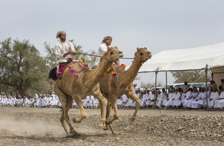 Khadal, Oman, April 7th, 2018: omani man racing on a camelのeditorial素材