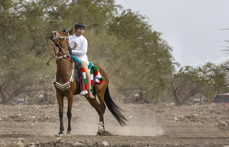 Khadal,  Oman, April 7th, 2018: omani man on a horse in a countryside of Omanのeditorial素材
