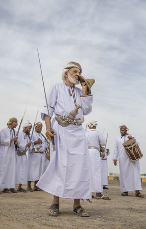 Ibri, Oman, 28th April 2018: men dancing and singing omani traditional wayのeditorial素材