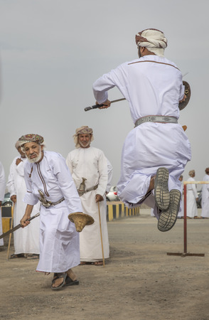 Ibri, Oman, 28th April 2018: men dancing and singing omani traditional wayのeditorial素材